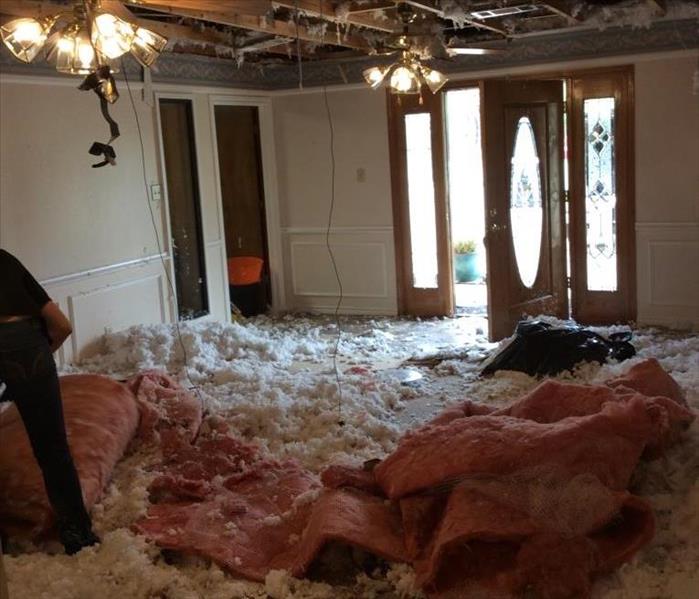 collapsed ceiling, insulation on the floor