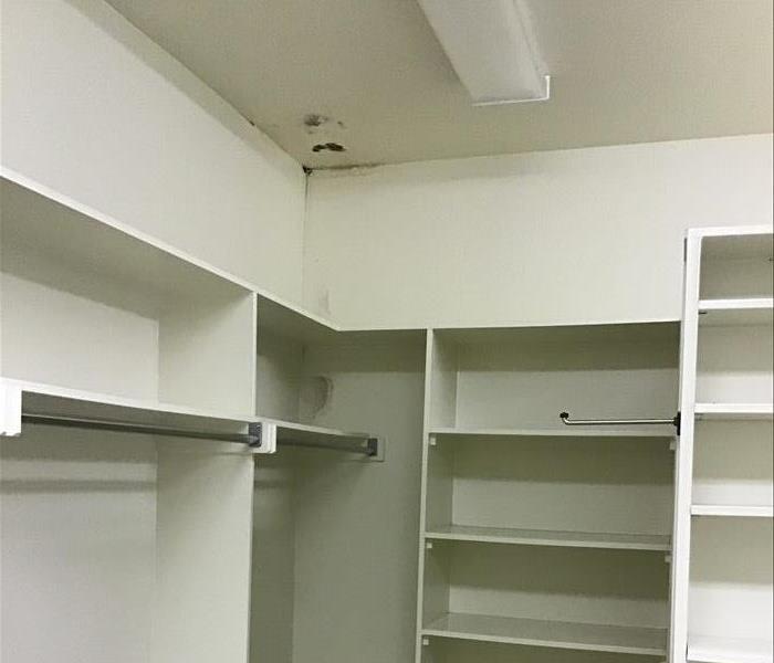 water damage and mold growth in closet