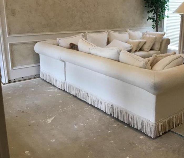restored flooring with a white couch