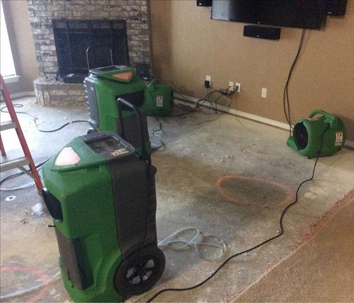 SERVPRO equipment drying out a cement floor
